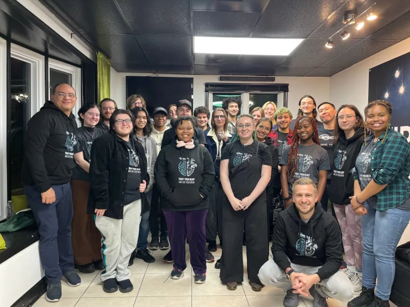 A group celebrating after Dr. Panic's Asylum opened
