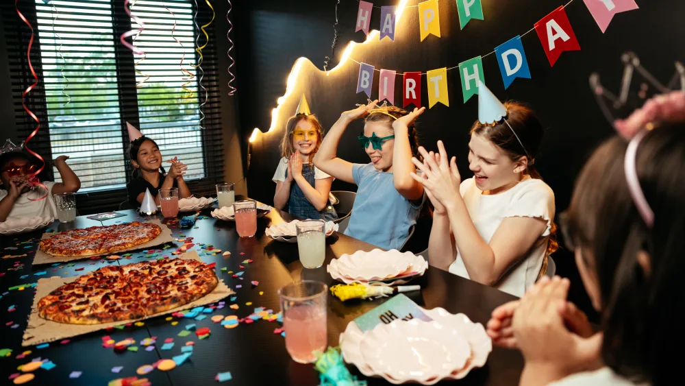 Adults celebrating a birthday at Bond's