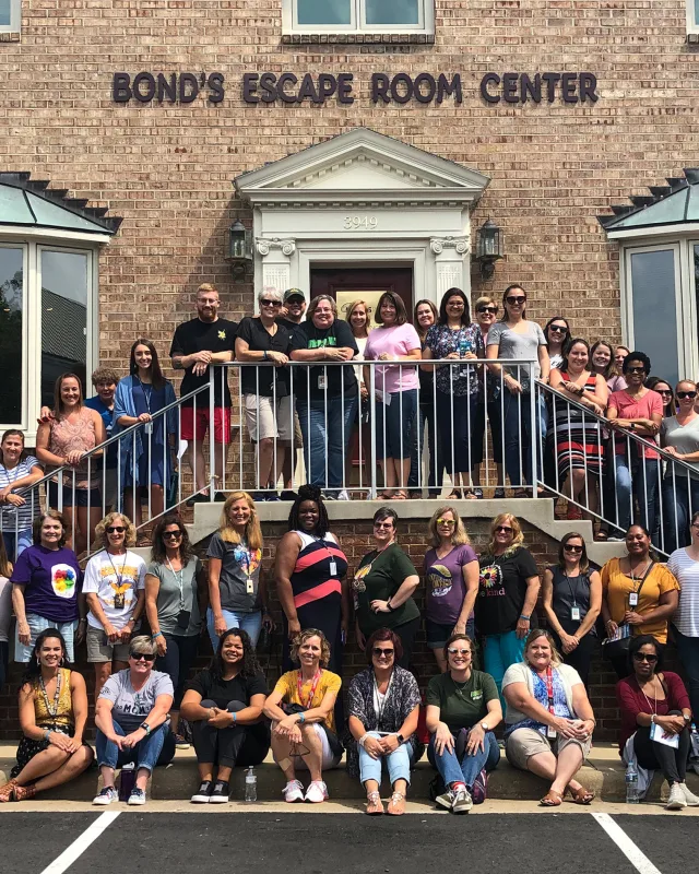 A large corporate group outside Bond's Fairfax after a team building event