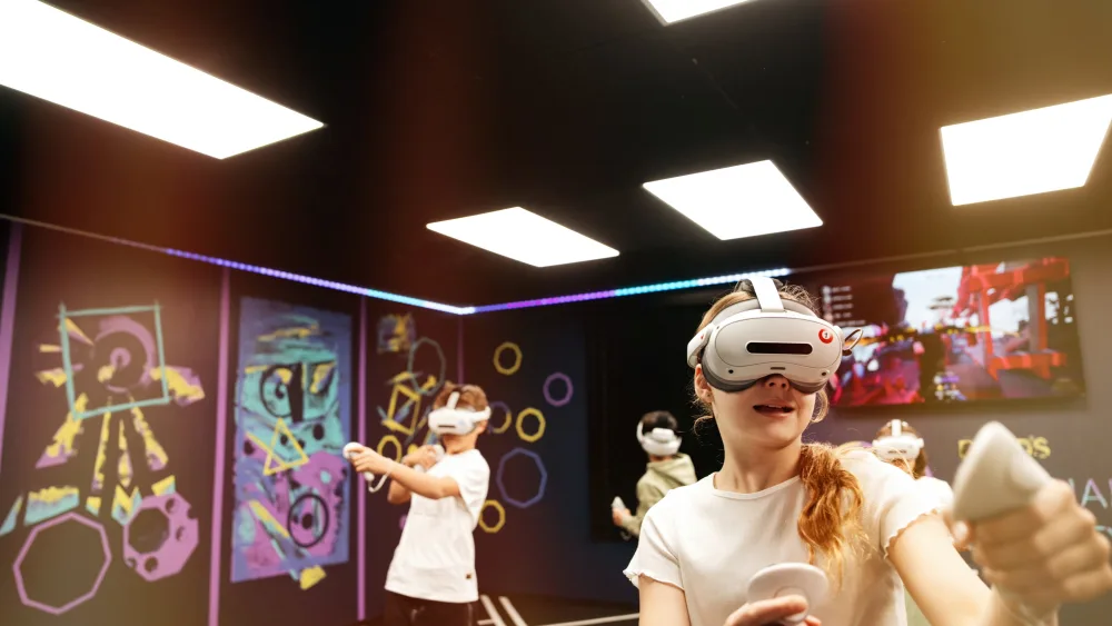 Players in free-roam VR headsets in the Bond's VR Arena